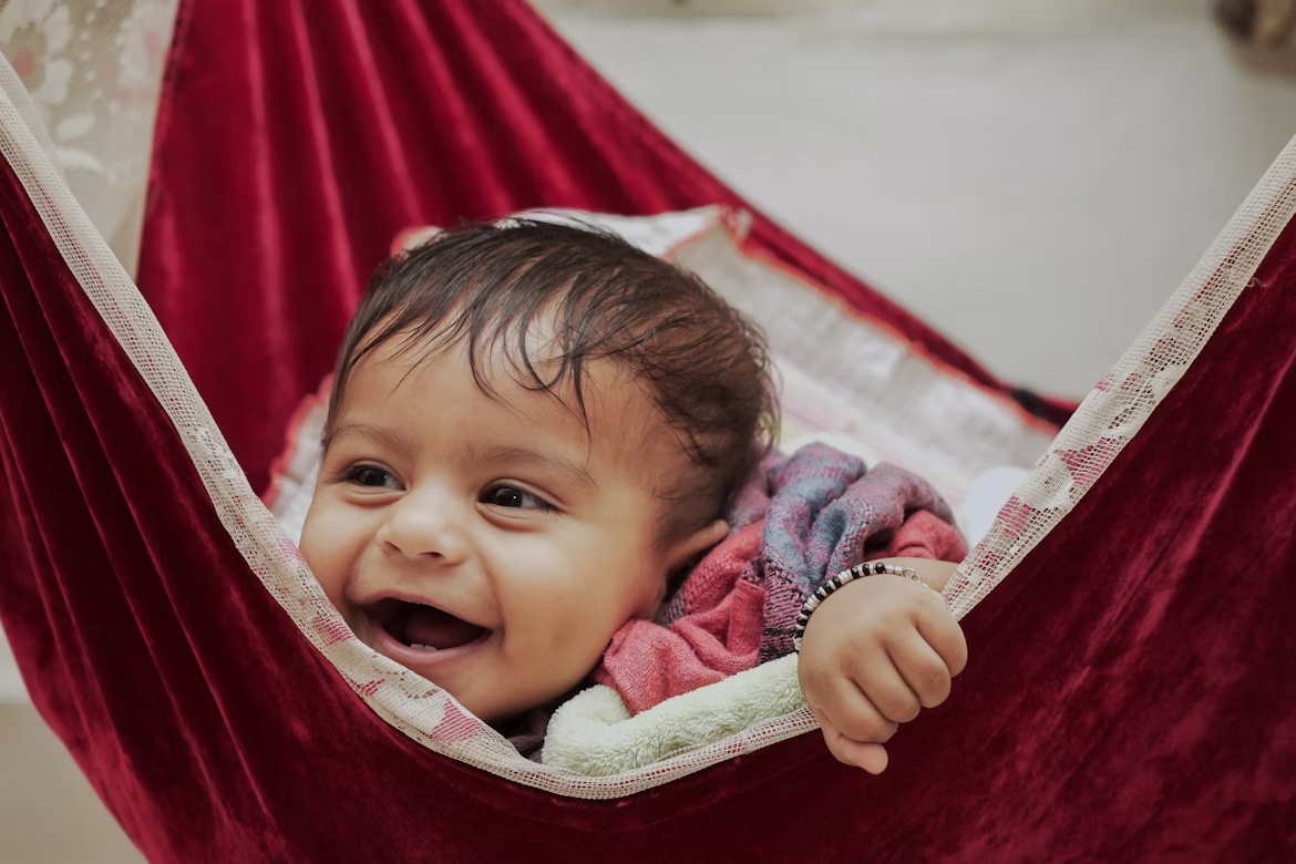 Parents holding newborn baby – gentle maternity and newborn photography Bangalore